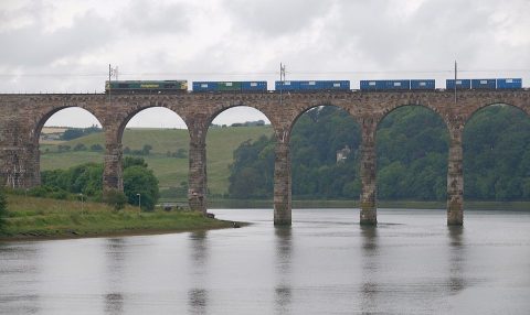 Freight train on Royal Border Bridge at Berwick upon Tweed in Northumberland, England