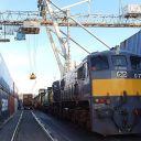 Between two canyons of containers, two intermodal trains are being prepared at Waterford's Belview Terminal in Ireland