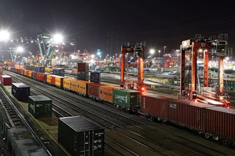 Night shot of intermodal train departing docks